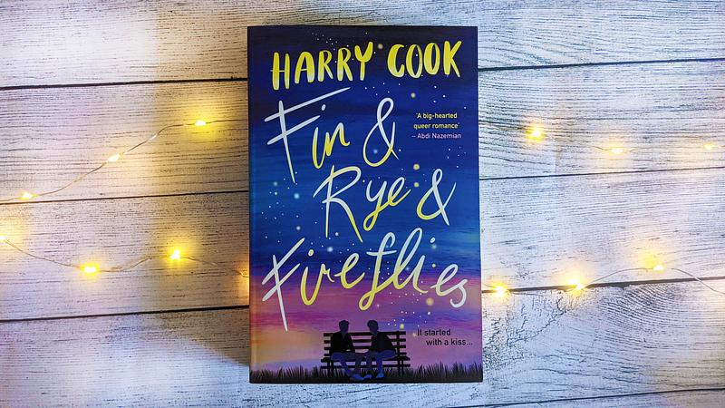Front cover of "Fin and Rye and Fireflies", featuring two boys facing each other with a sunset behind them